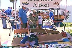 Kids-Build-a-Boat-in-action painting sections of boat