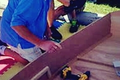 Kids-Build-a-Boat using power tools to assemble boat
