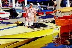 Jim-Guidry-holding-trophy-aboard-his-early-Donzi-18